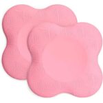 Deux coussins de yoga pour le genou et le coude de couleur rose.